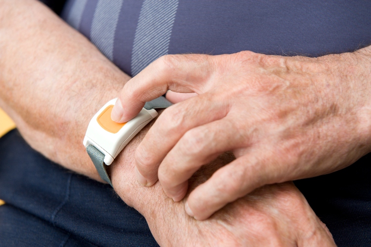 Senior pressing medical alert bracelet