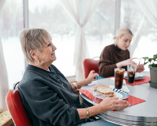 elderly woman enjoying lunch