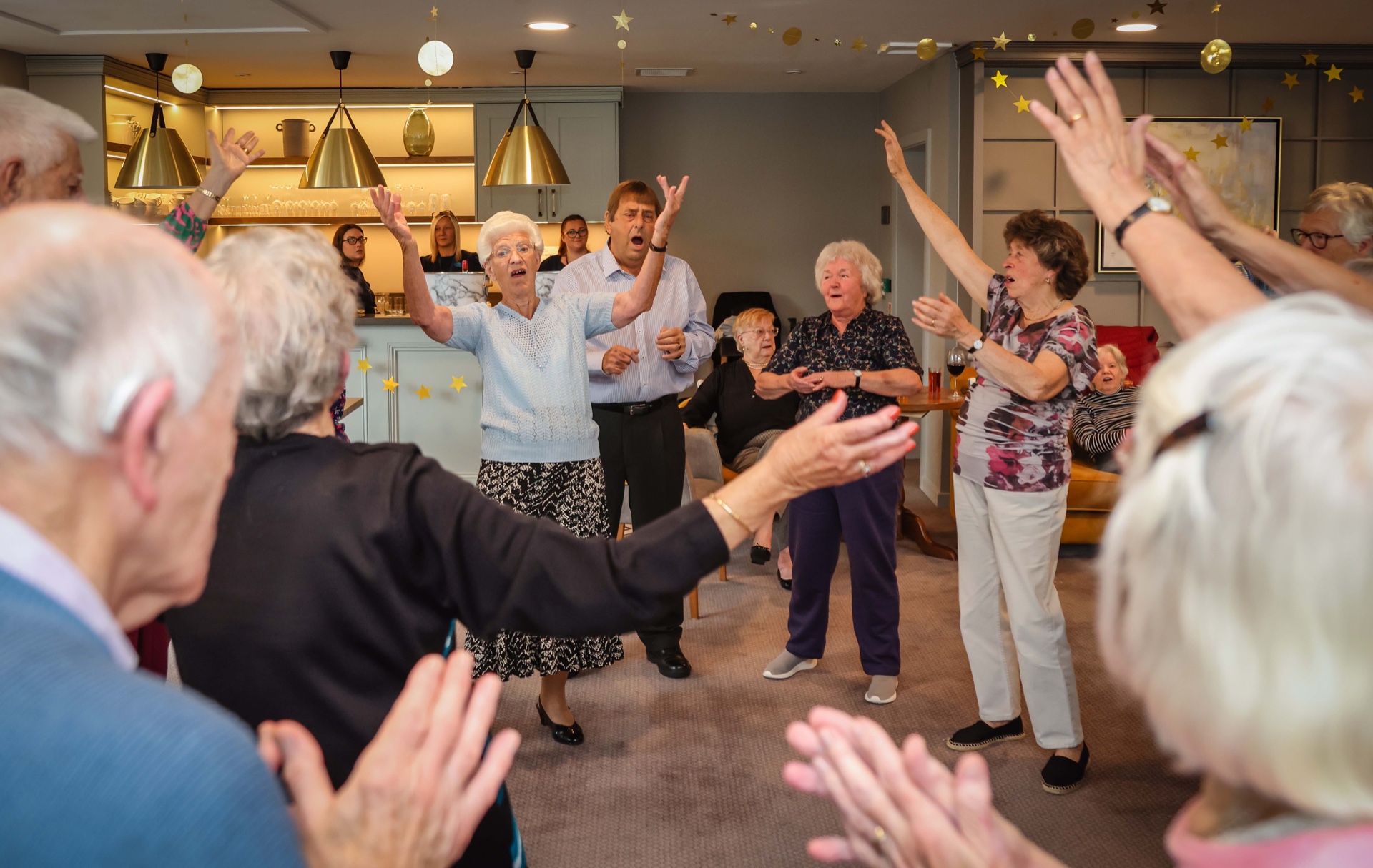 residents singing and dancing