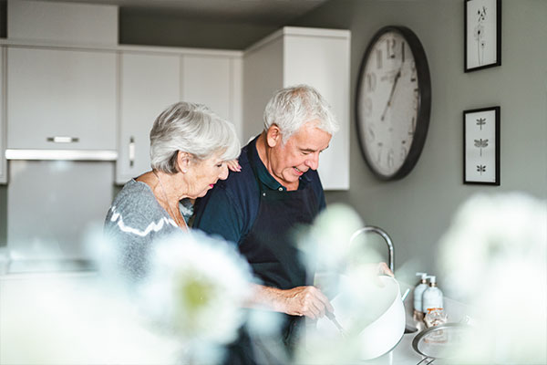 Homeowners baking a cake together